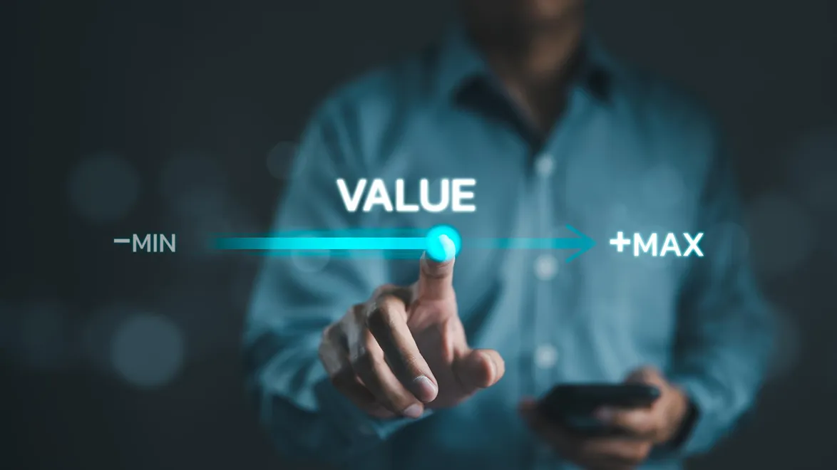 A person touching a digital interface showing a VALUE slider from minimum to maximum, representing value optimization