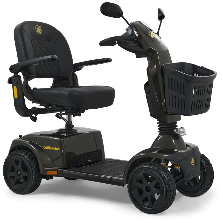 Close-up of a black Golden Technologies mobility scooter showing the adjustable handlebars, front storage basket, and a plush, quilted diamond-stitch captain's seat with armrests.