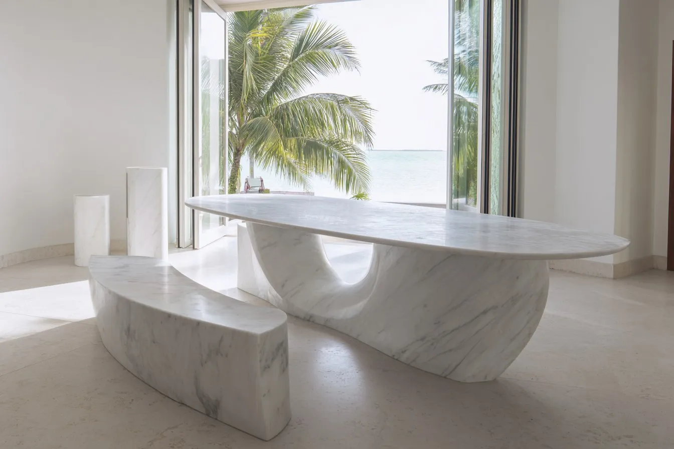 Sculpted white marble dining table and matching curved bench