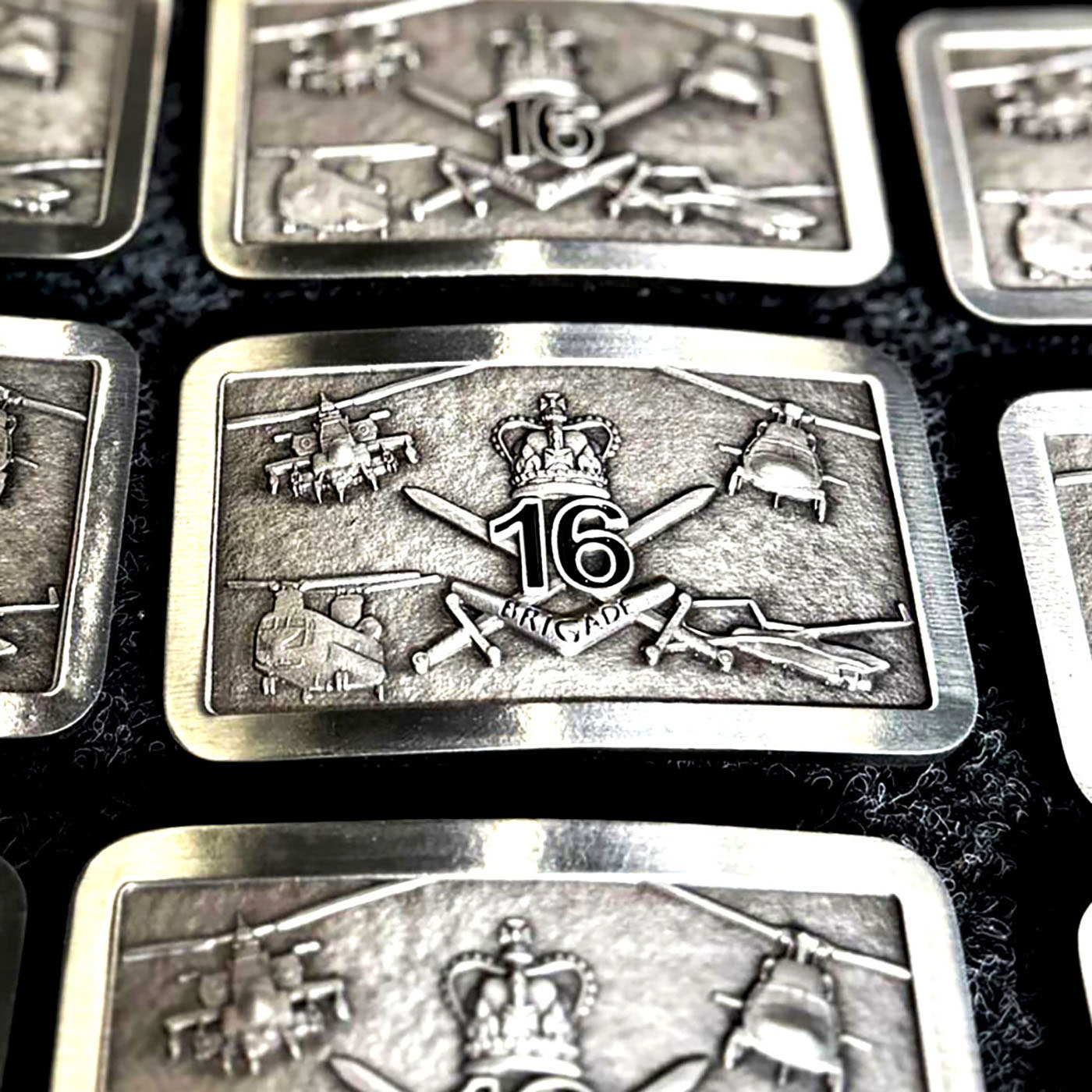 Custom military style belt buckles produced for operational and service recognition