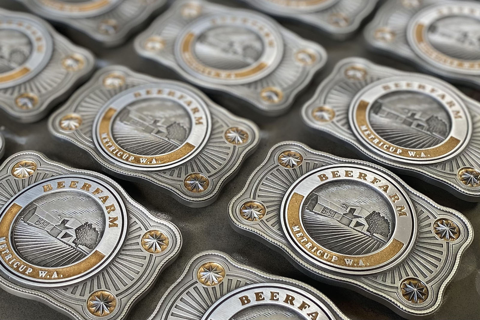 Beerfarm branded custom belt buckles produced for boutique brewery promotion