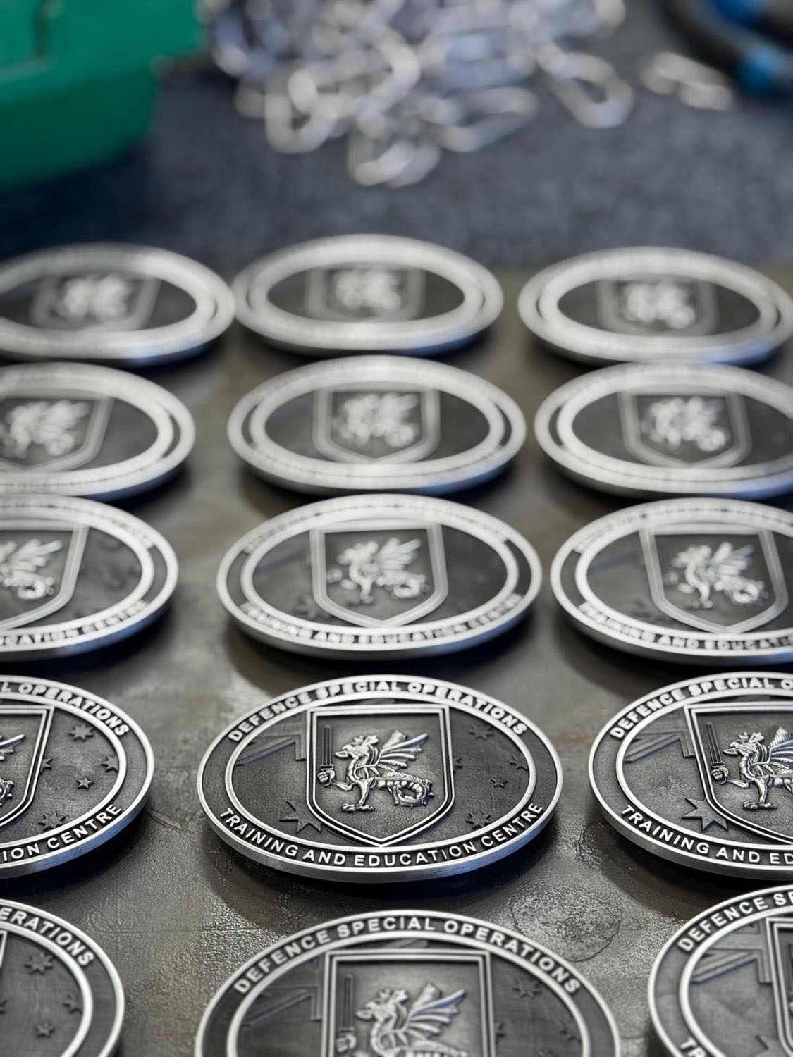Military unit commemorative belt buckles featuring wyvern-inspired emblem