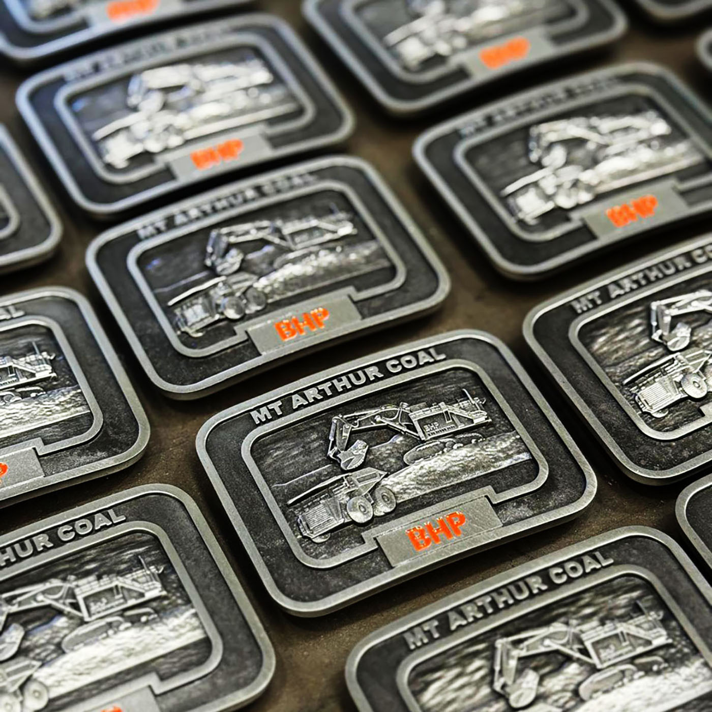 Custom mining recognition belt buckles produced for BHP Mt Arthur Coal operations
