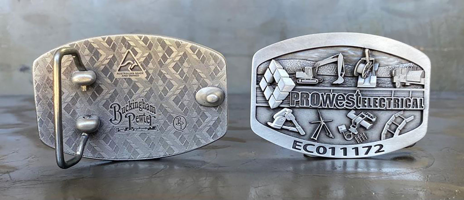 Custom branded belt buckle for electrical contracting business promotion