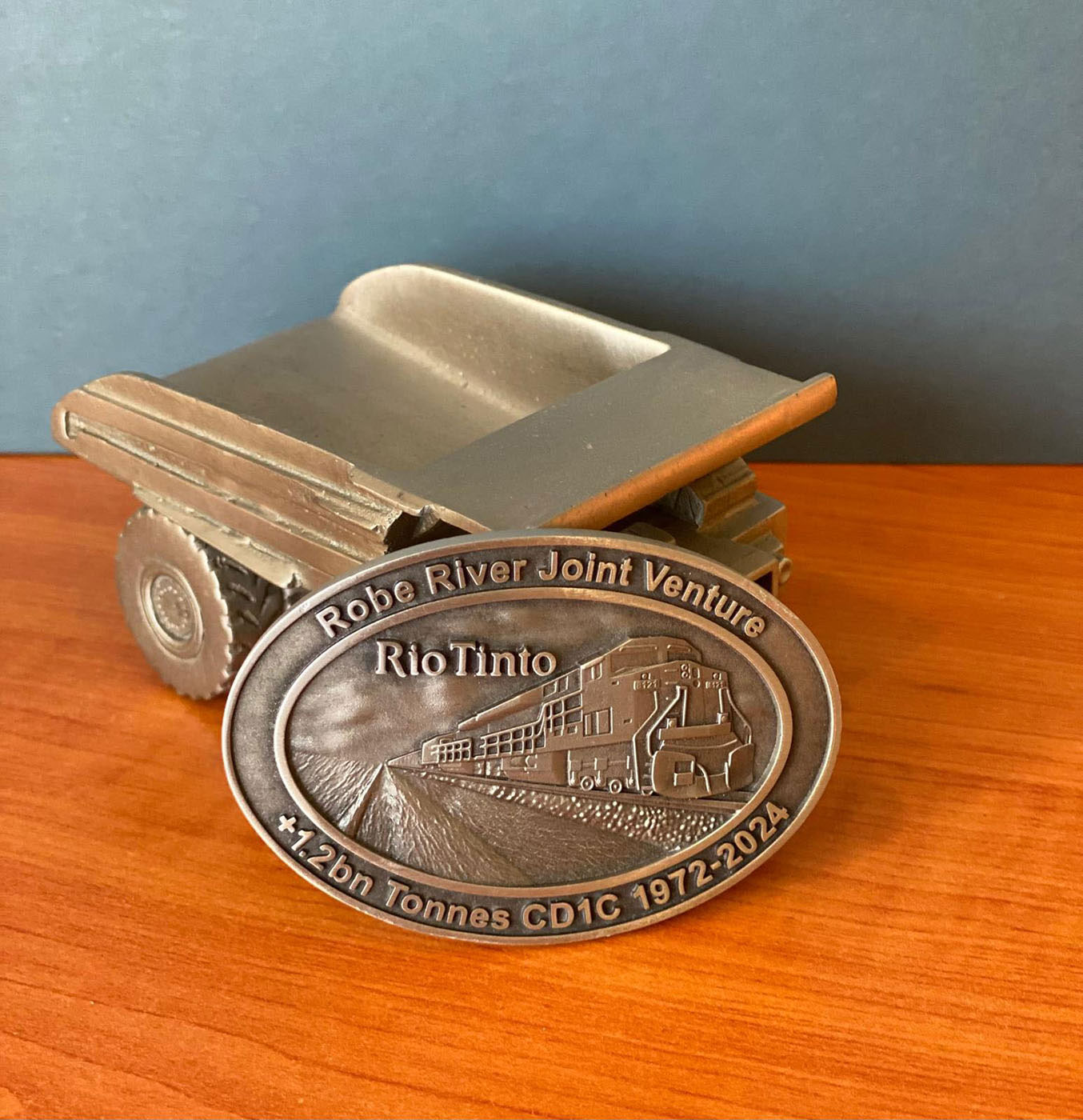Rio Tinto Robe River Joint Venture commemorative belt buckle with haul truck figurine display