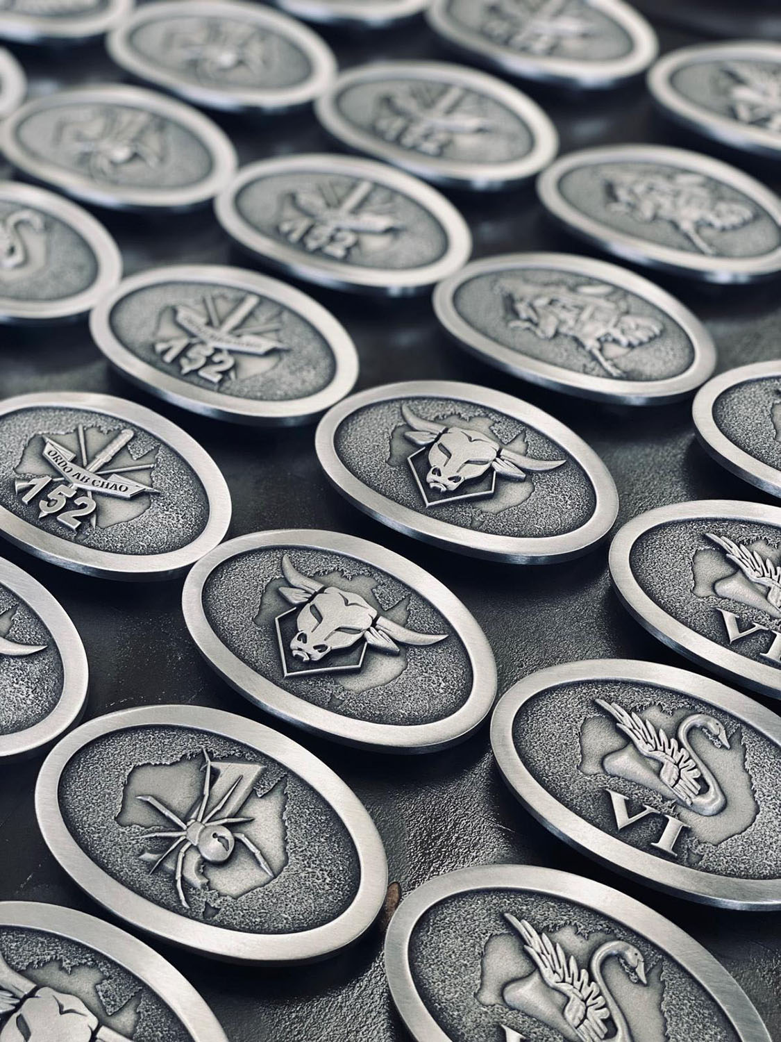 Military unit commemorative belt buckles featuring Australian wildlife inspired emblems
