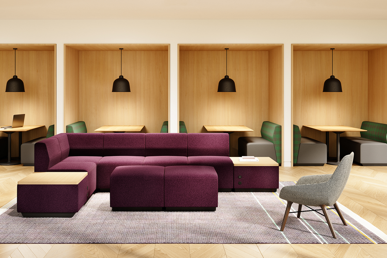 Modern commercial breakroom with purple modular sofa, gray chair, and wooden booths with green seats.