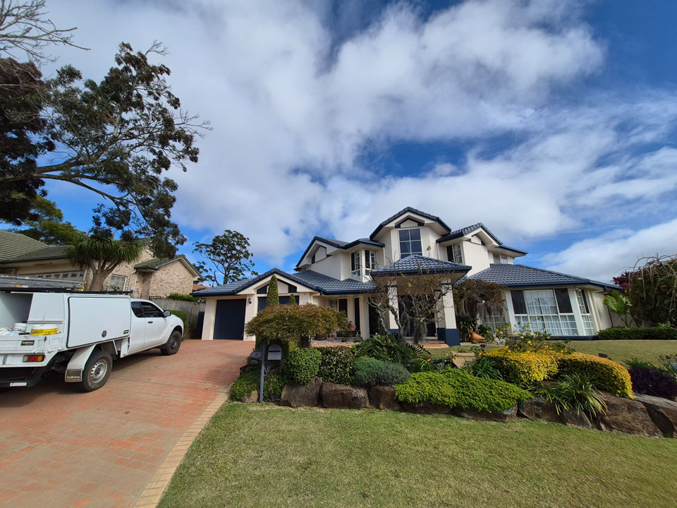 Front of a double-story home after receiving a full exterior paint.
