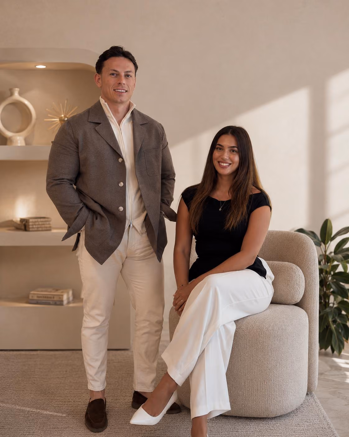 Two people talking during a meeting in a bright modern office space.