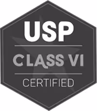 Hexagonal badge with text USP Class VI Certified in white and gray letters on a black background.