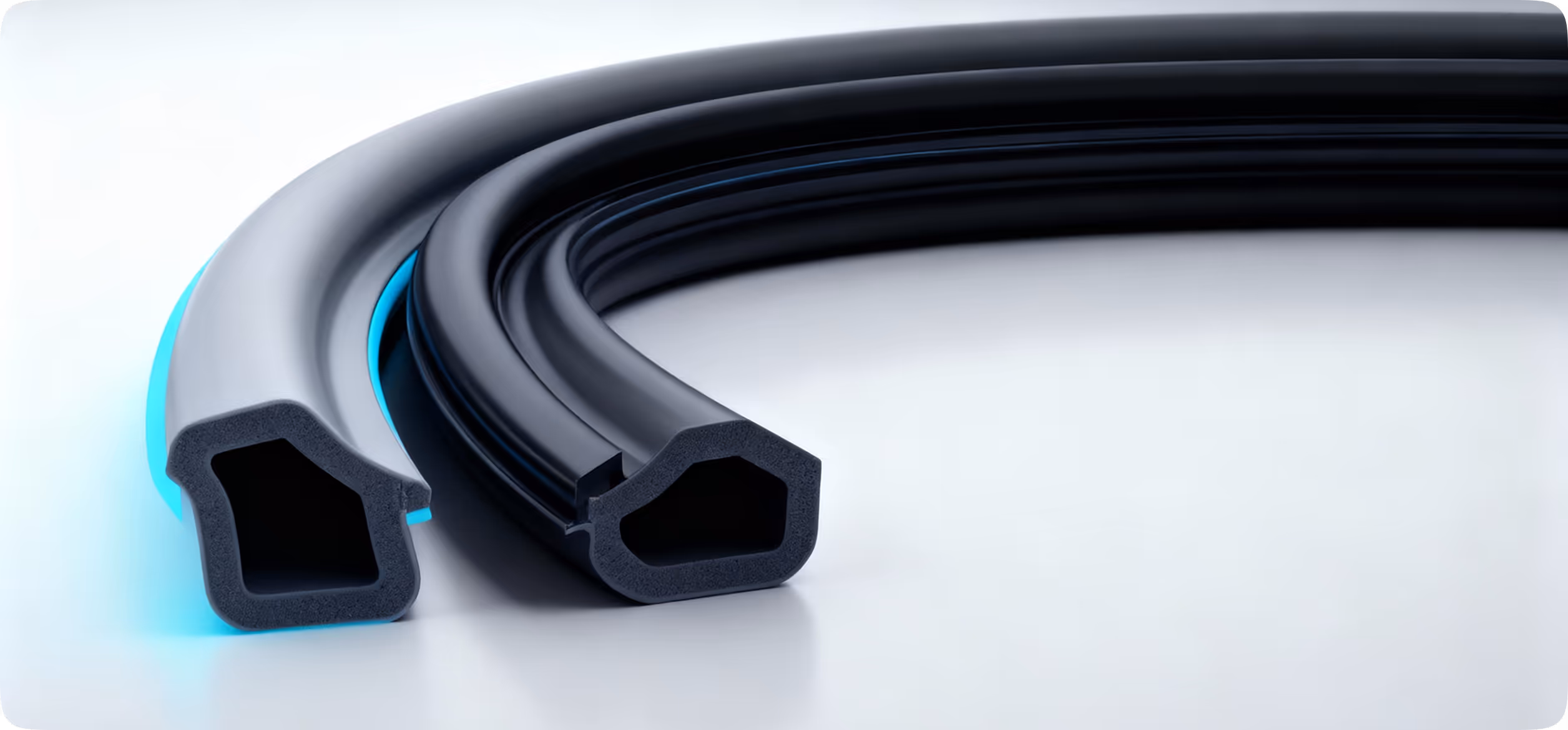 Two black rubber sealing strips with hollow triangular cross-sections on a white surface, one with a blue inner lining.