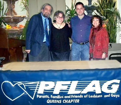 Four people standing together holding Brenda Howard Memorial Award certificates, February 2009