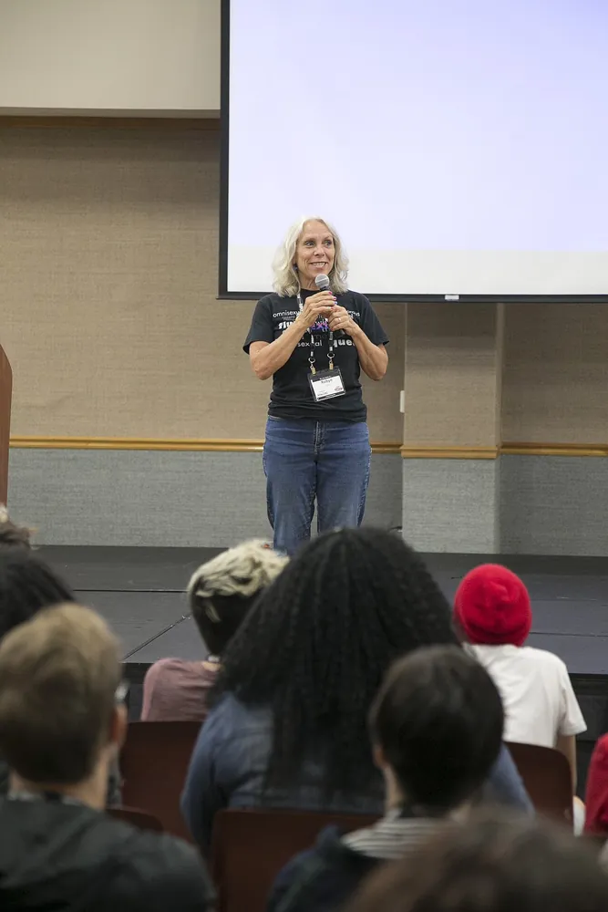 Robyn Ochs speaking at a podium at Campus Pride, July 2016
