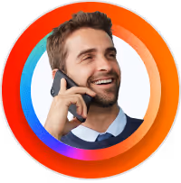 Smiling man with beard talking on a smartphone, framed by a colorful circular ring