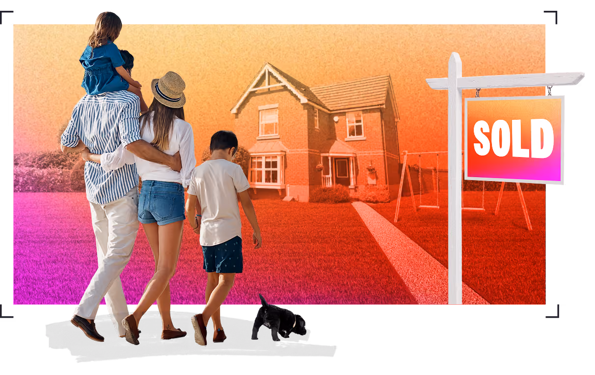 A family of four with a small dog walks toward a two-story brick house with a front yard, beside a white real estate sign that says 'SOLD'.