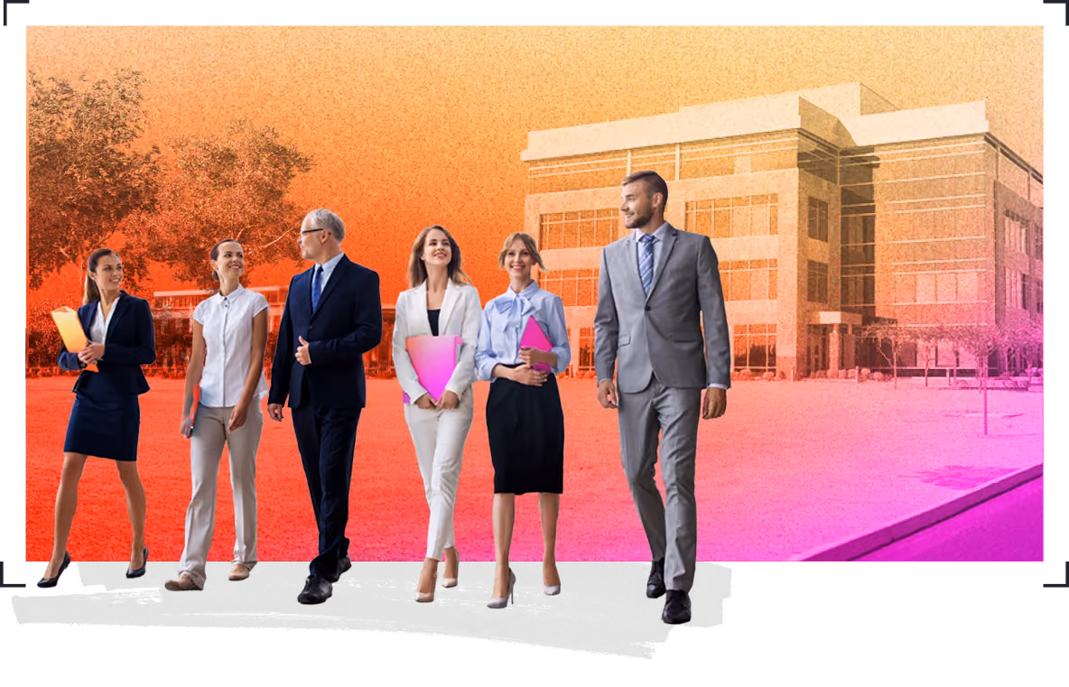 Group of six business professionals walking together outside a corporate office building