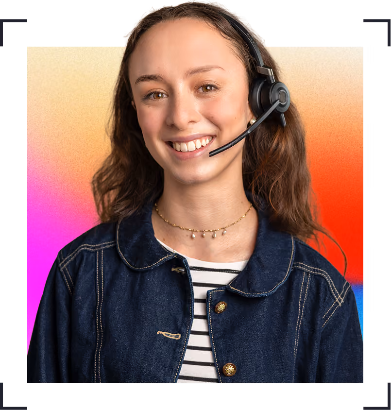 Smiling woman wearing a headset, denim jacket, and striped top on a colourful gradient background.