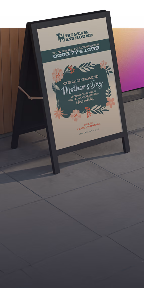 A-frame sign for The Star and Hound advertising a Mother's Day 2 or 3 course Sunday dinner with free bubbles.