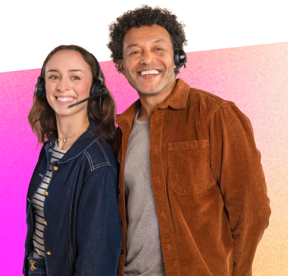 Smiling man and woman wearing headsets, standing side by side against a pink and beige background.