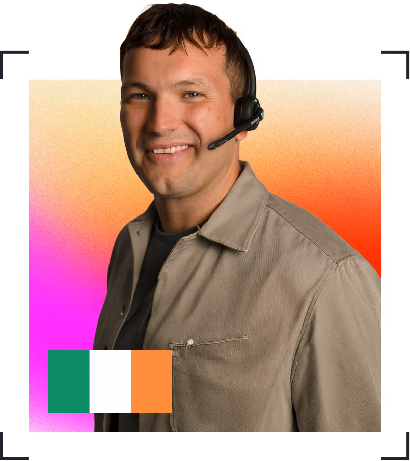 Smiling man wearing a headset and light brown jacket, with an Irish flag in the bottom left corner and a colorful gradient background.