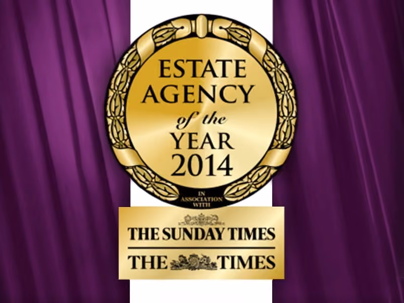Gold medal reading Estate Agency of the Year 2014 with The Sunday Times and The Times logos below.