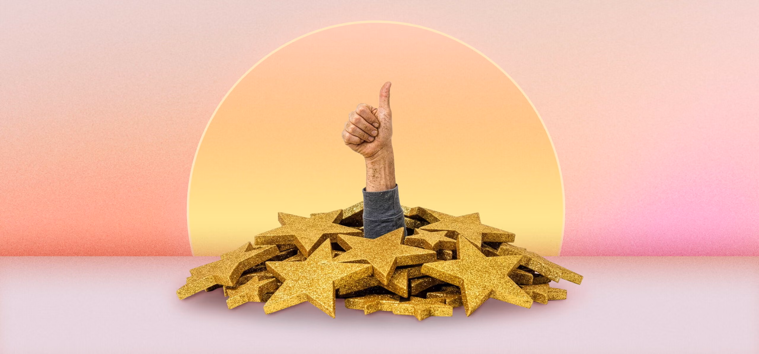 Hand giving thumbs up rising from pile of golden stars against a gradient pink and yellow background.