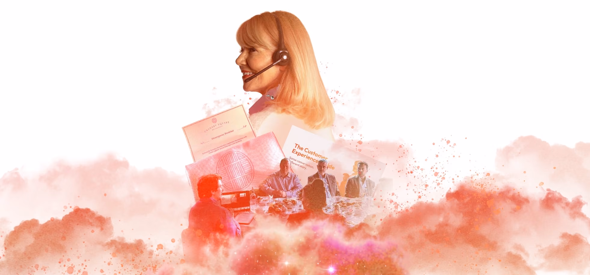 Woman with blonde hair and headset smiling above a group around a table with documents and food.