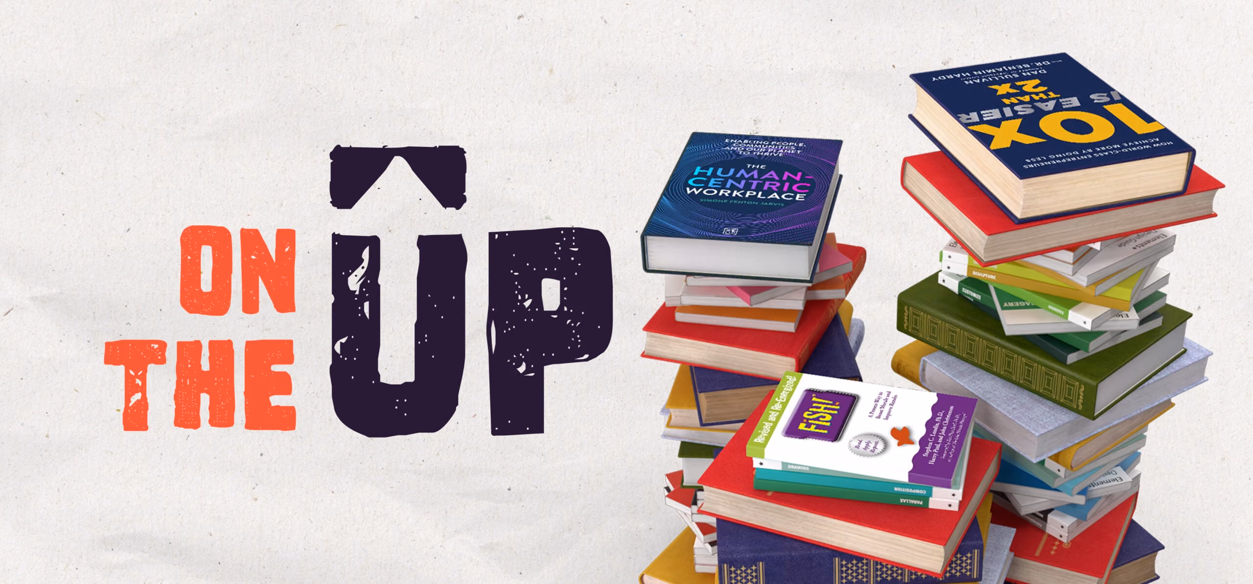 Stack of colorful books with the text On The Up written beside them on a light background.
