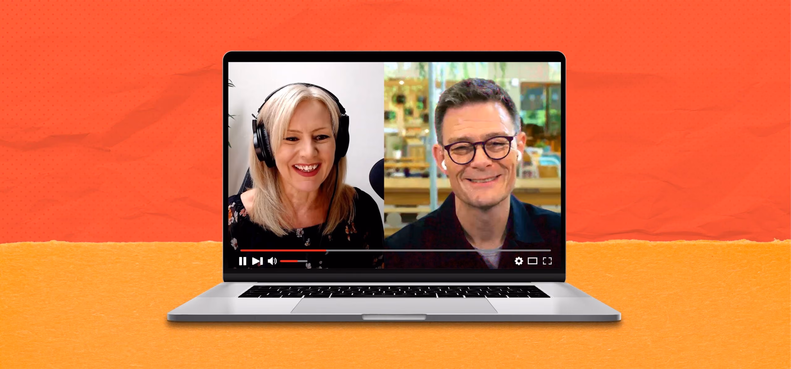 Laptop screen showing a video call with a smiling woman wearing headphones and a man with glasses.