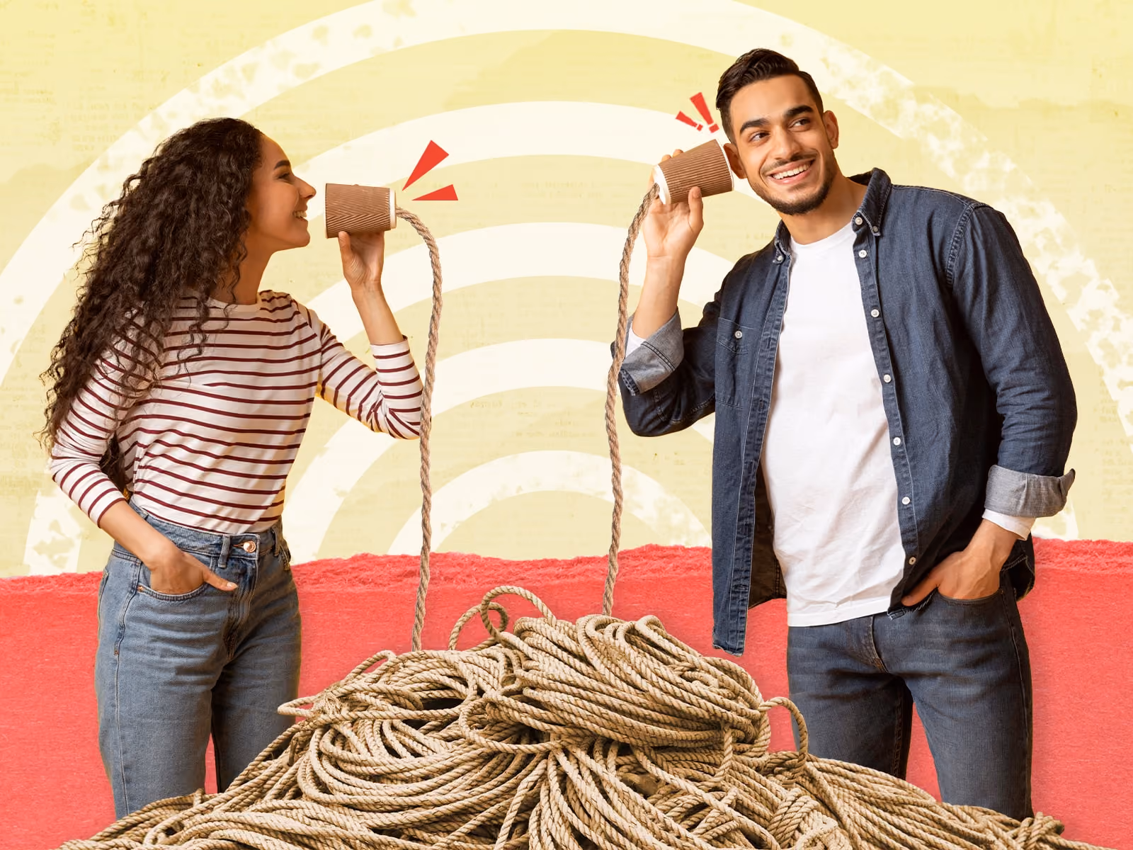 Man and woman communicating using paper cups connected by a long tangled rope.