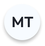 Circular badge with the letters MT in bold black text on a white background.