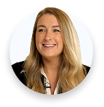 Smiling woman with long blonde hair wearing a black blazer in a circular crop.