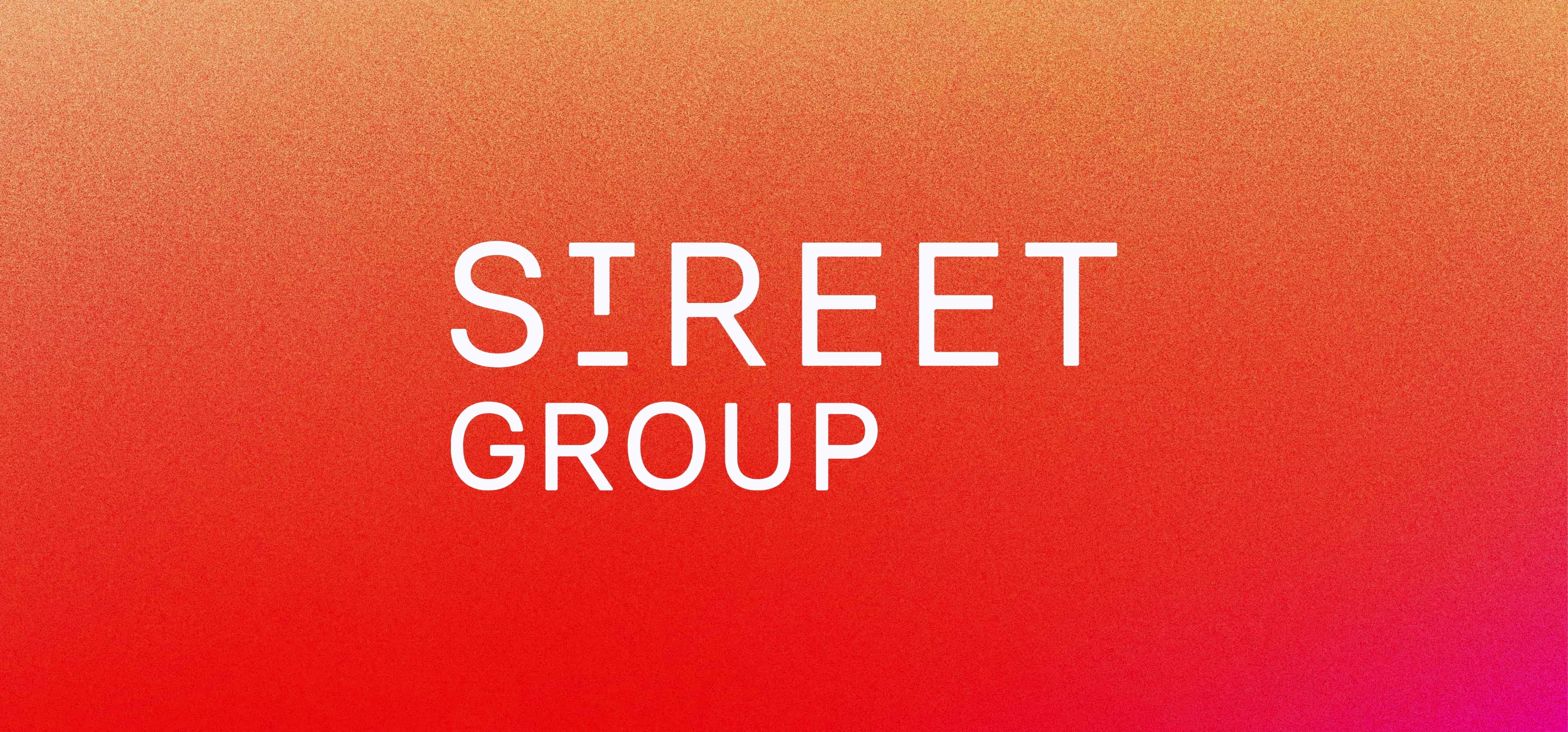 Text 'STREET GROUP' in white capital letters on a gradient background transitioning from orange to red to pink.