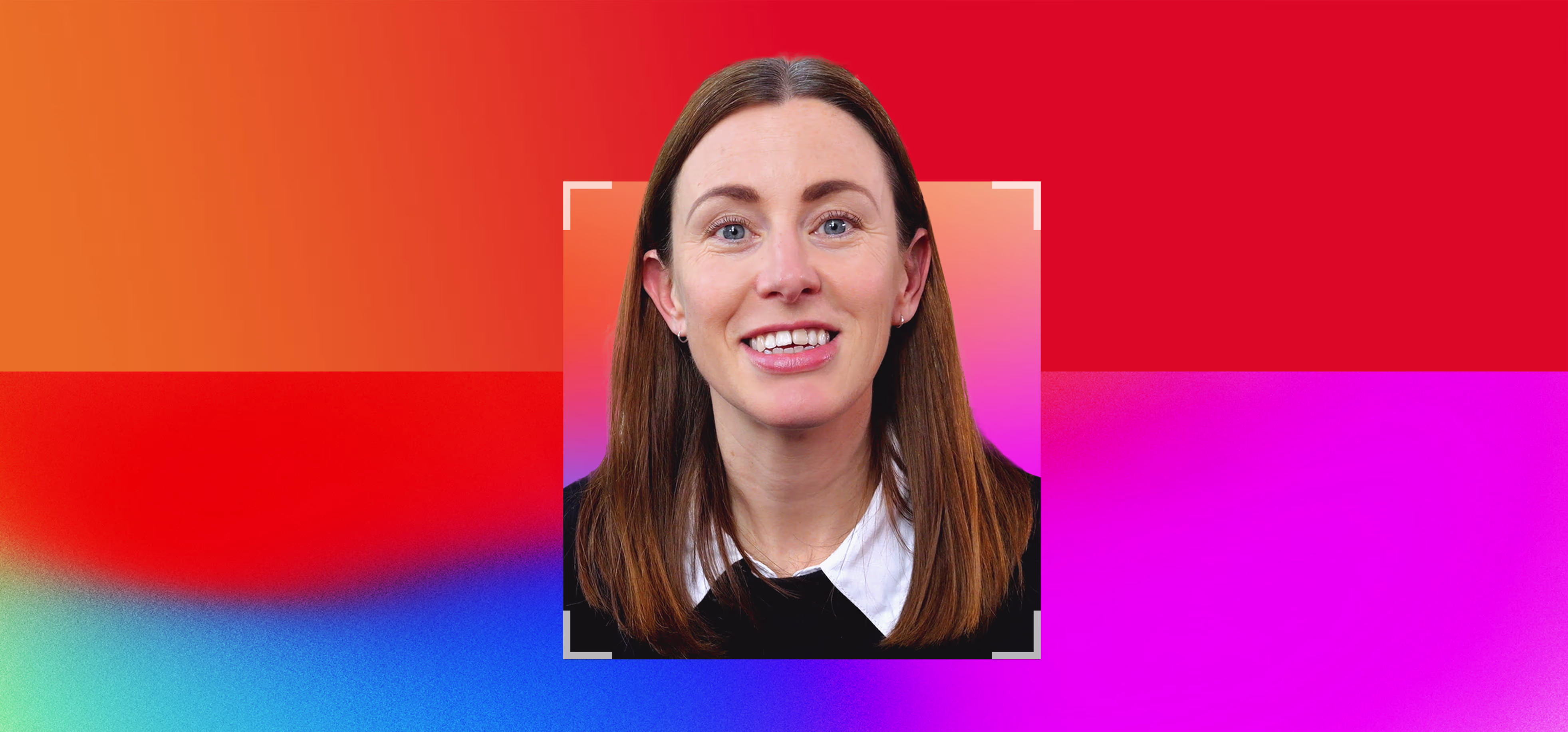 Smiling woman with straight brown hair and blue eyes, wearing a black top with white collar, against a vibrant gradient background of red, orange, pink, and blue.