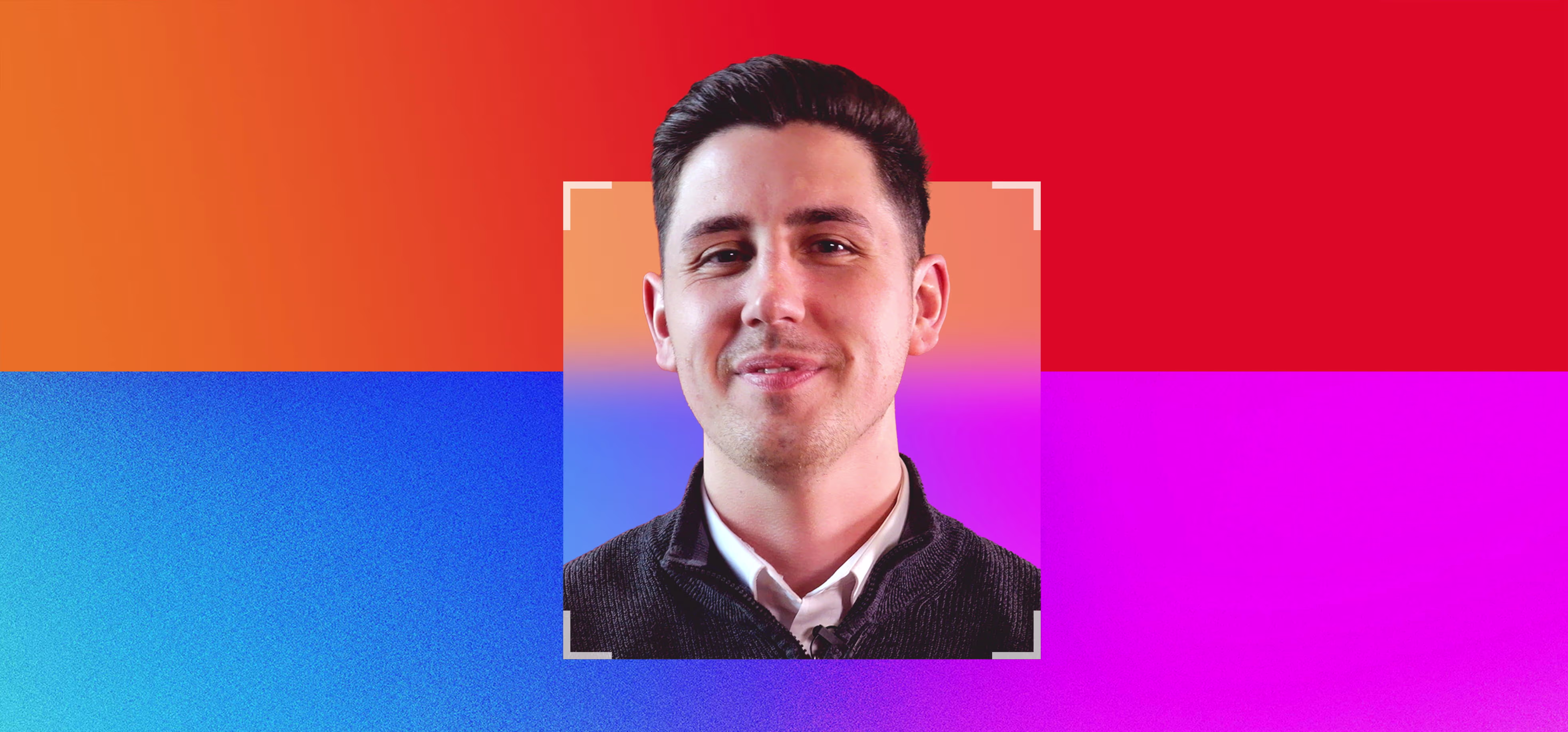 Smiling man with dark hair in a black jacket and white shirt against a vibrant background of red, orange, blue, and pink sections.