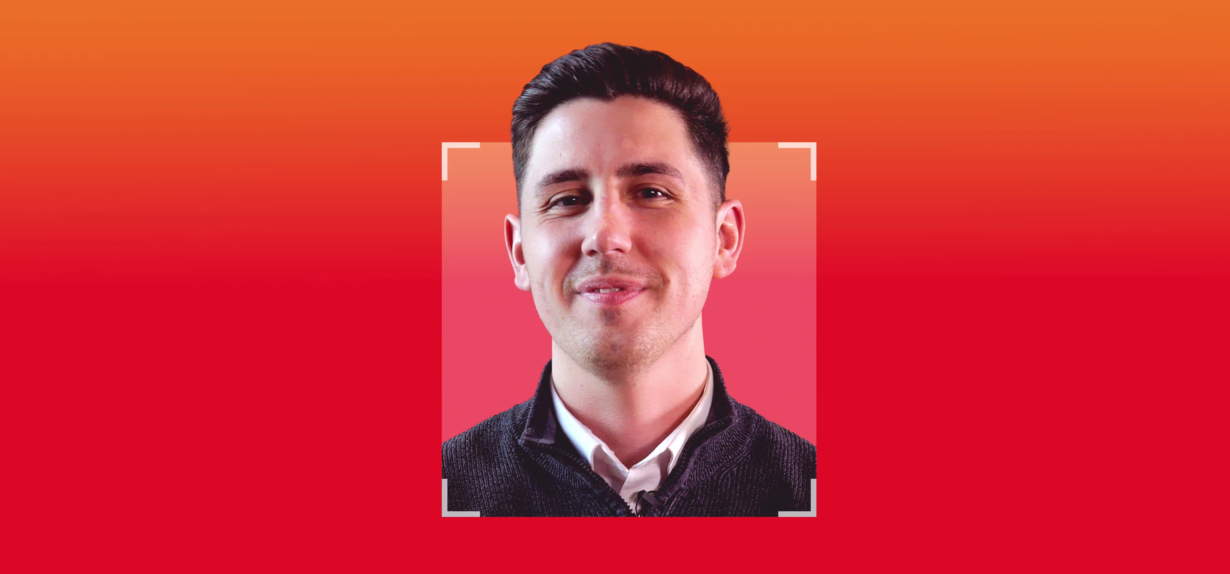 Smiling young man with short dark hair and a white-collared shirt under a dark sweater, framed by a white square on a red to orange gradient background.