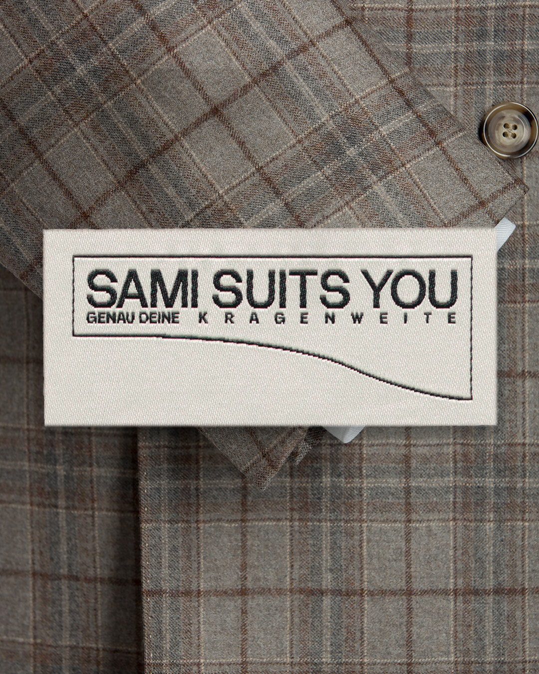 Rectangular brand label with a curved line on suit fabric