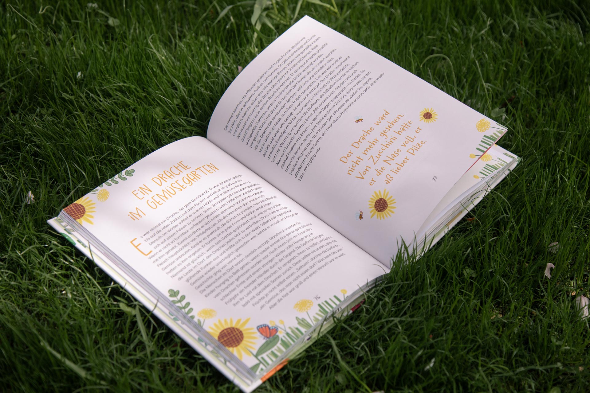Open book pages with text and yellow flowers around the edges