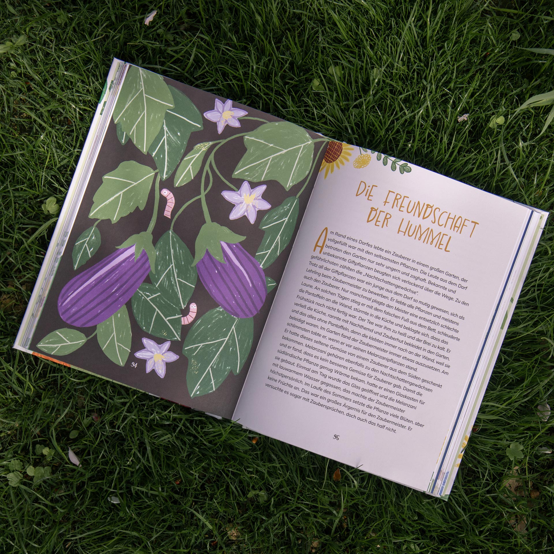 Spread with a dark aubergine illustration and a pale text page