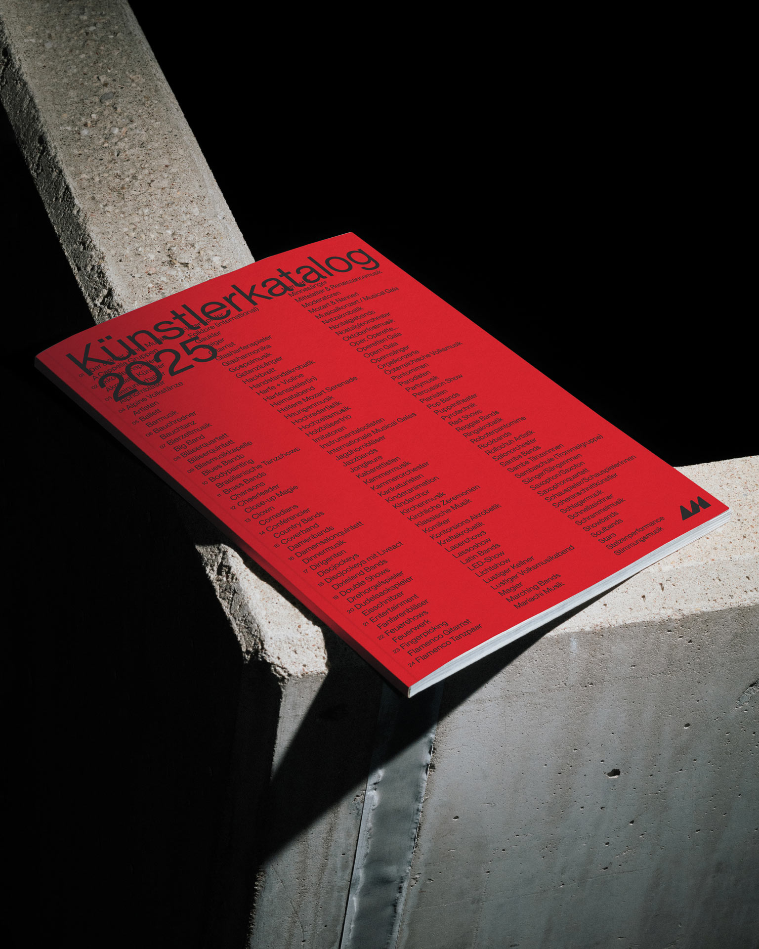 Red Ars Media printed piece on a concrete edge