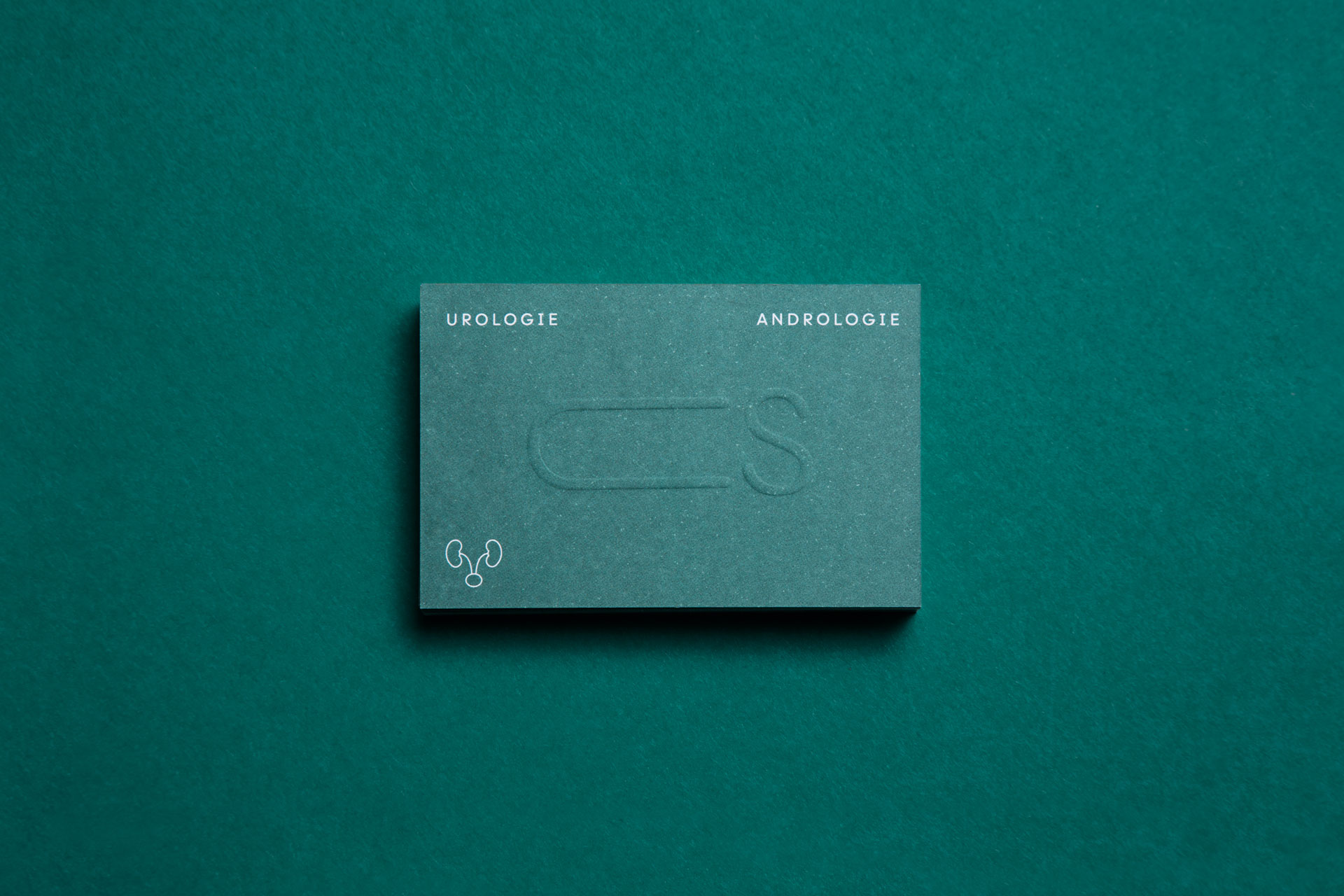 Embossed green business card identifying urology and andrology