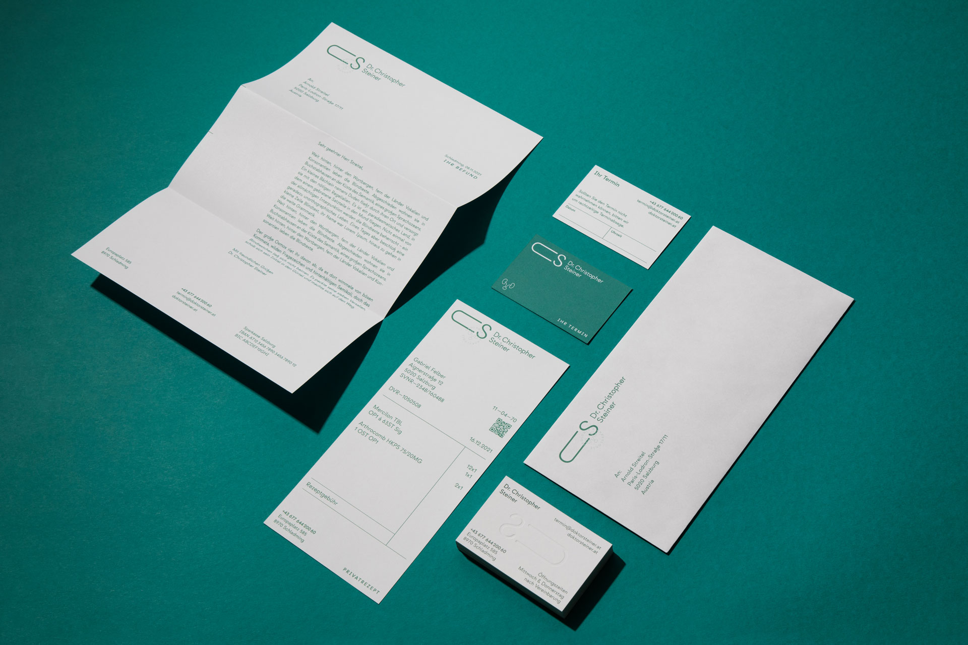 Stationery set with letterhead, cards and an open brochure