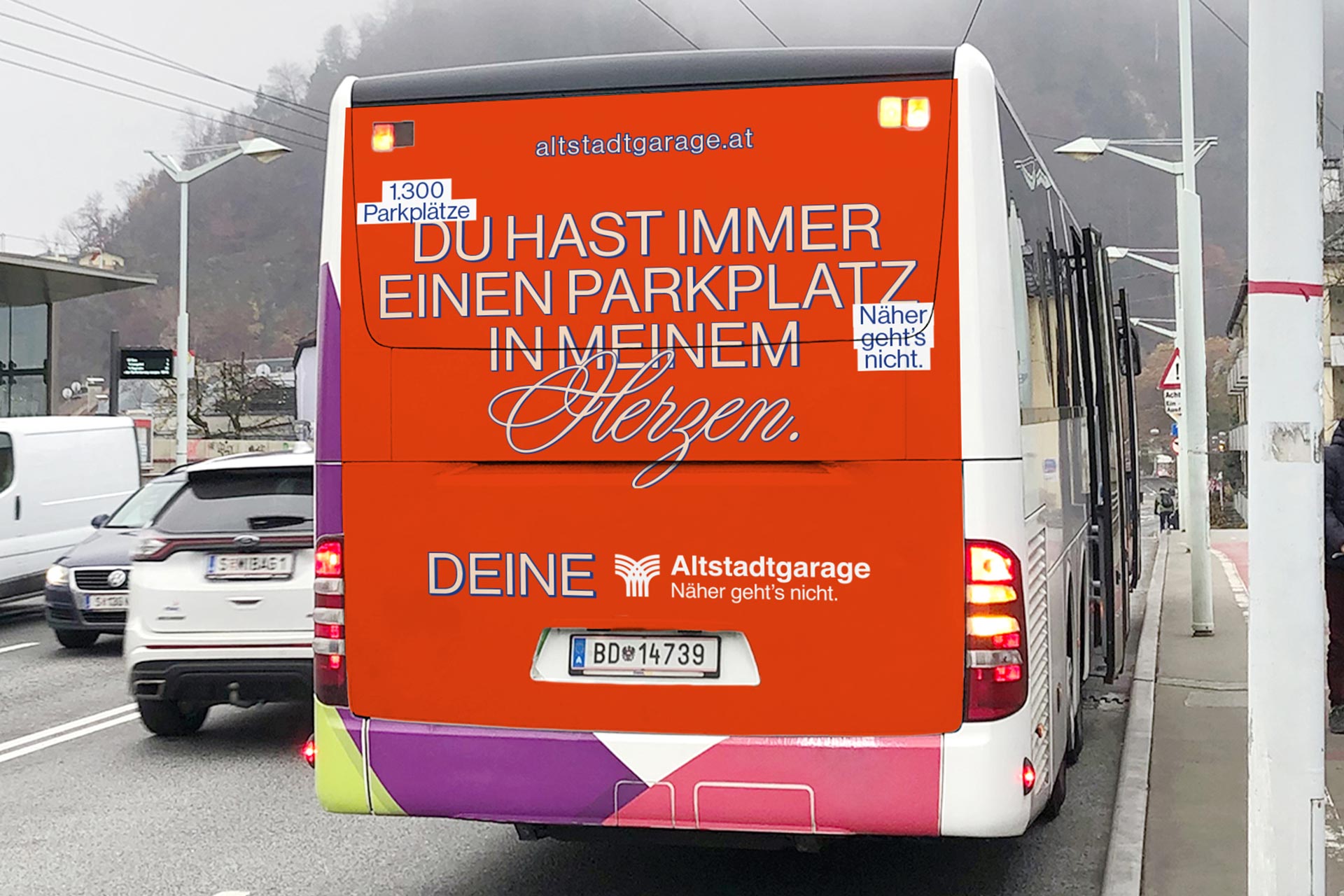 Rear of a bus with an orange parking-themed love message for Altstadtgarage