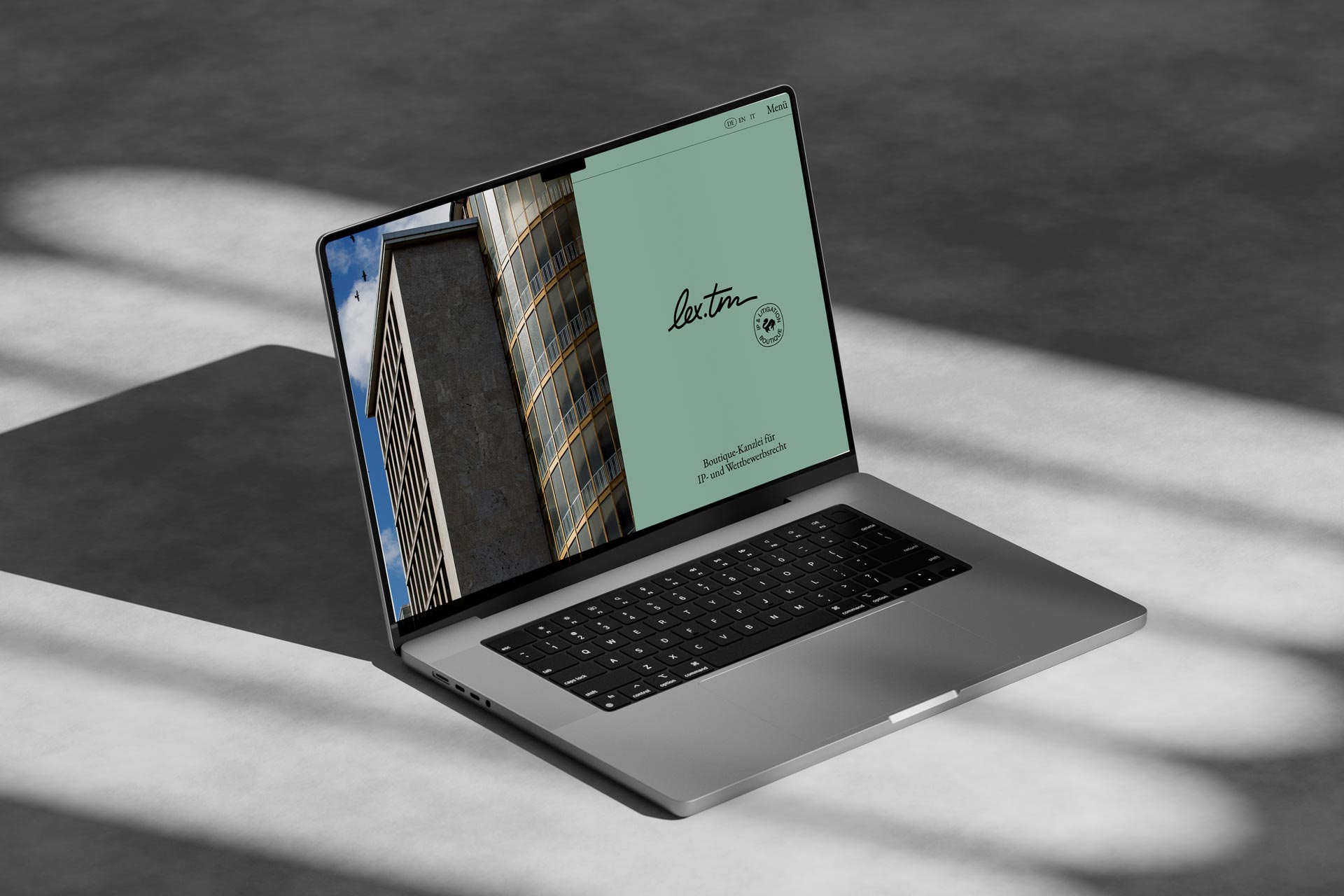 Laptop showing the lex.tm website, architectural photography and a mint brand panel