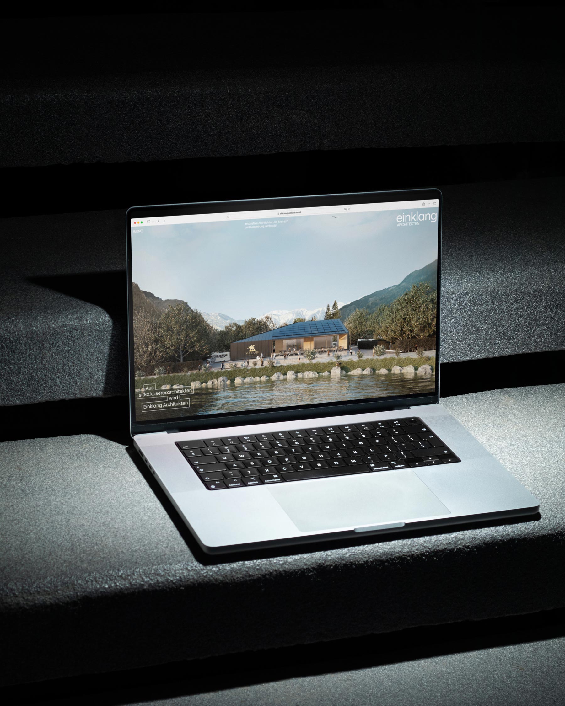 Einklang website with landscape photography on a laptop