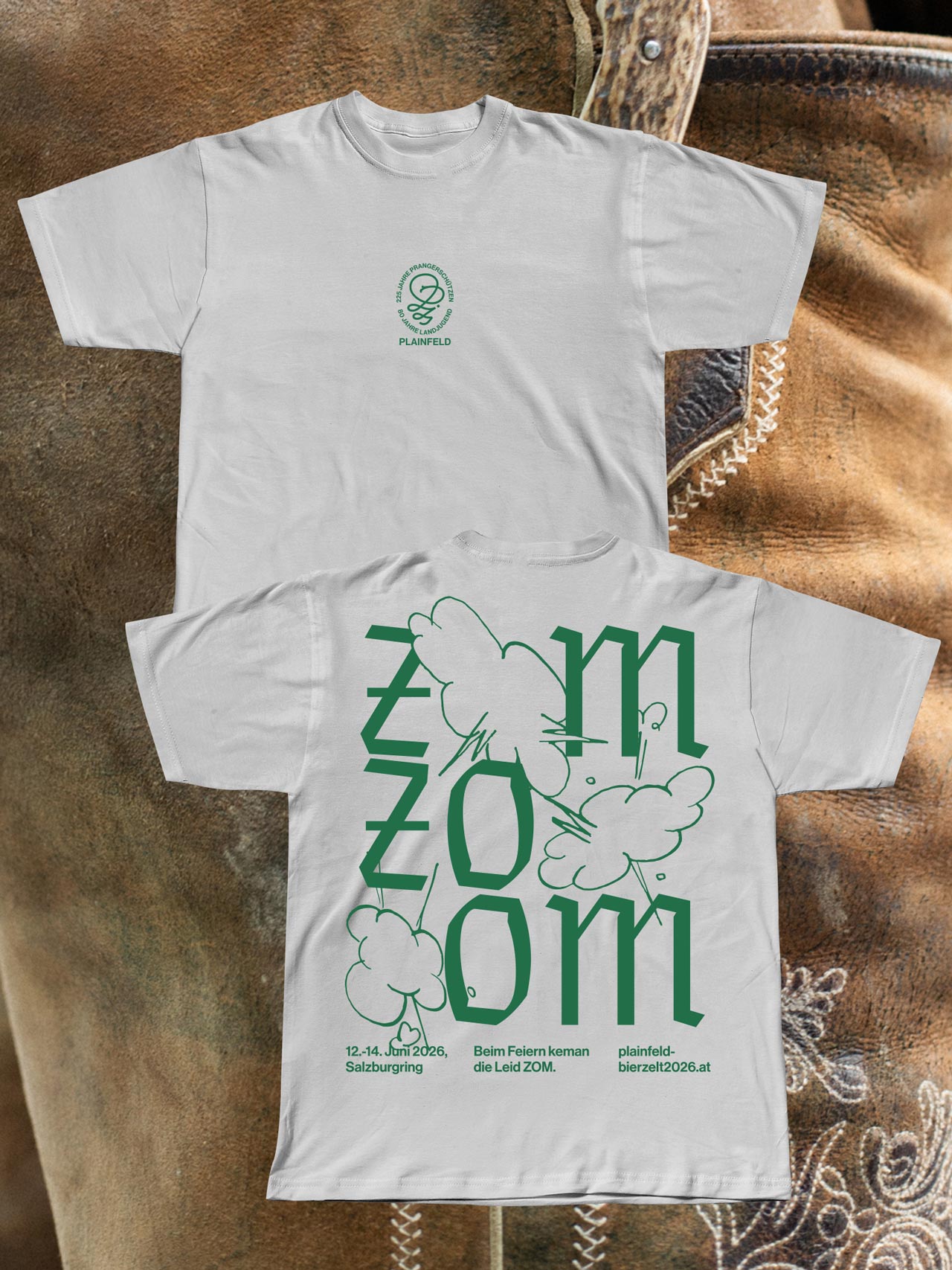 Front and back of white Zom Zom Zom T-shirts with green printing