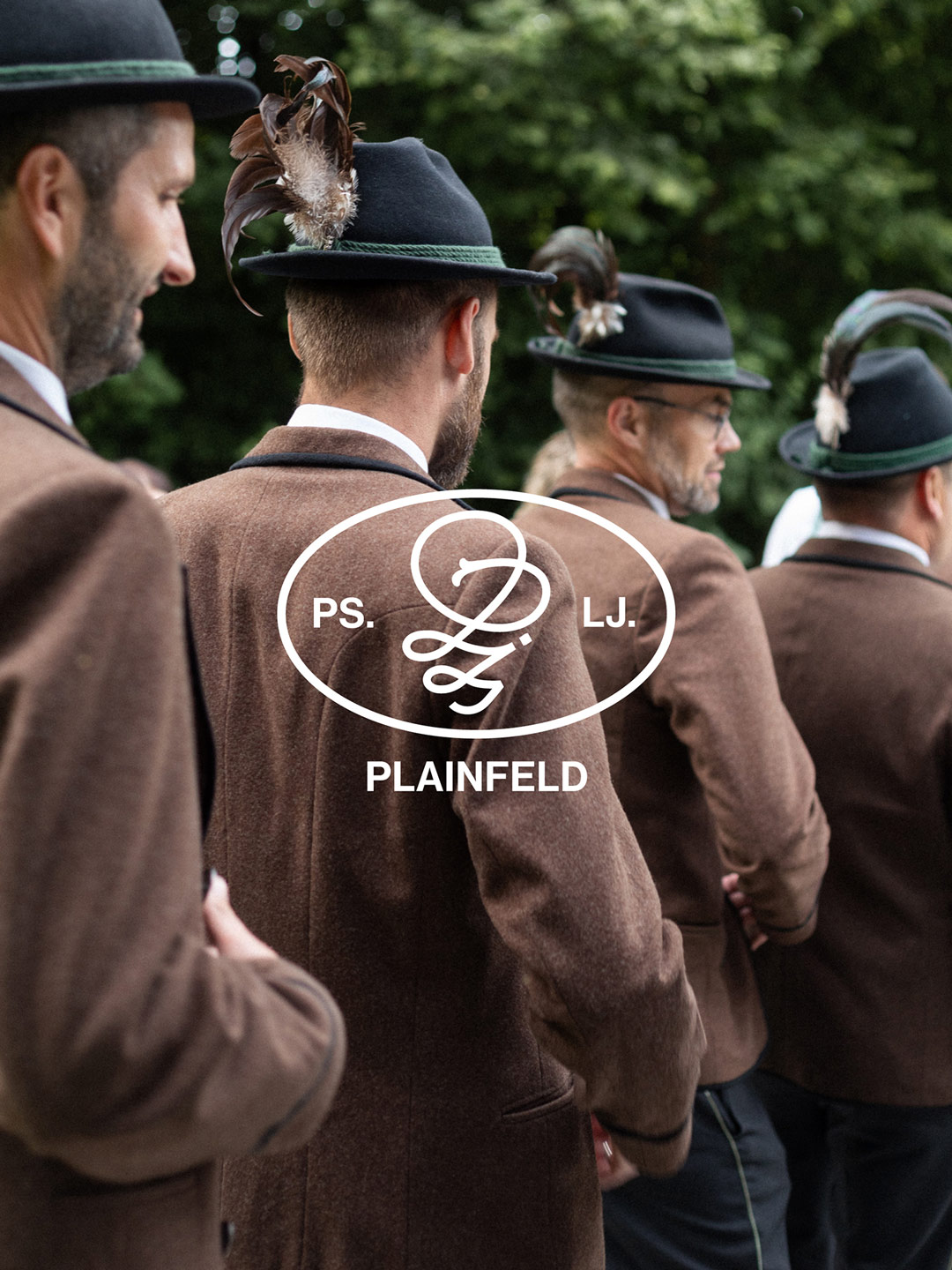 Rear view of people in traditional dress with an overlaid Plainfeld association symbol