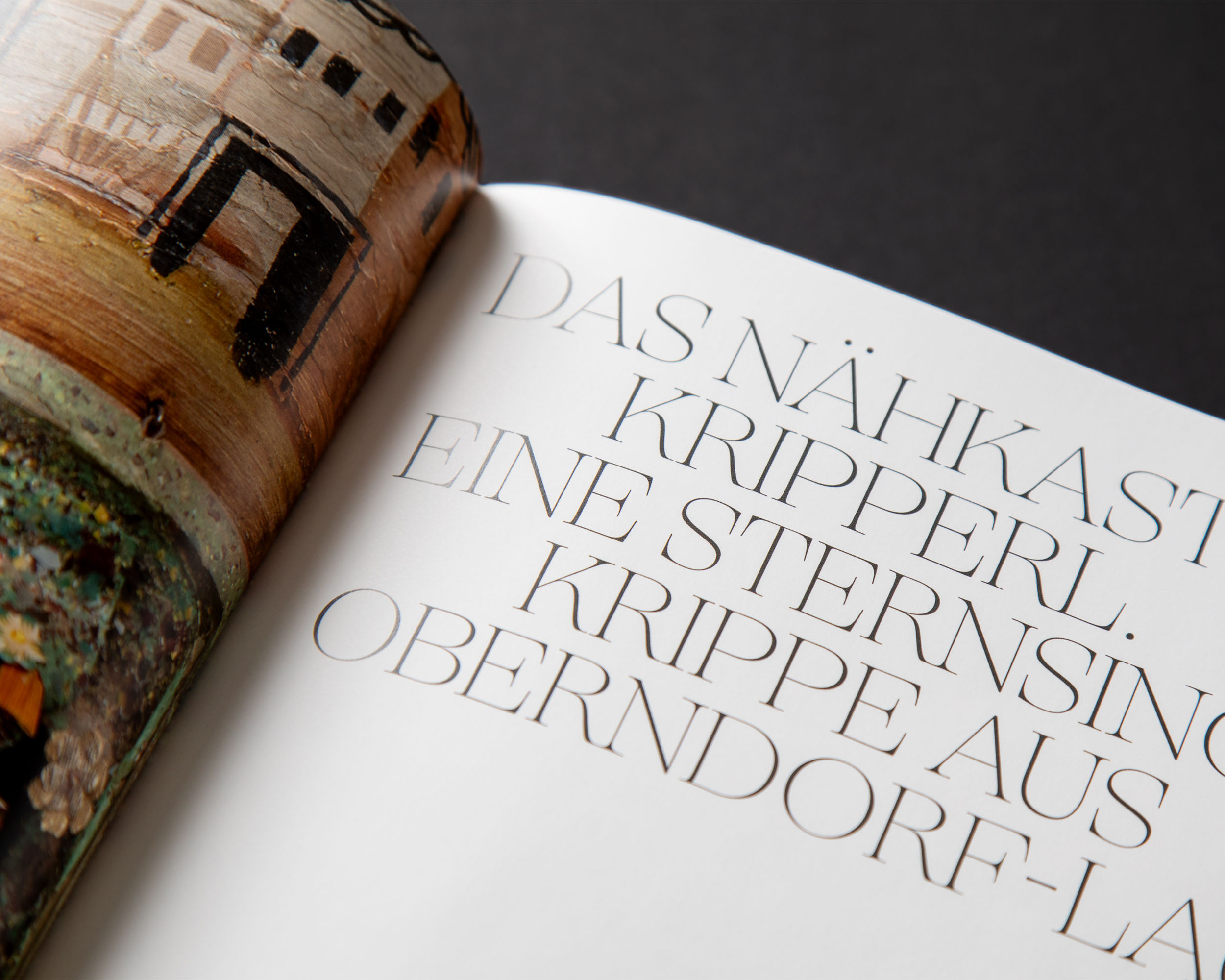 Large serif typography in the chapter on a box nativity scene from Oberndorf
