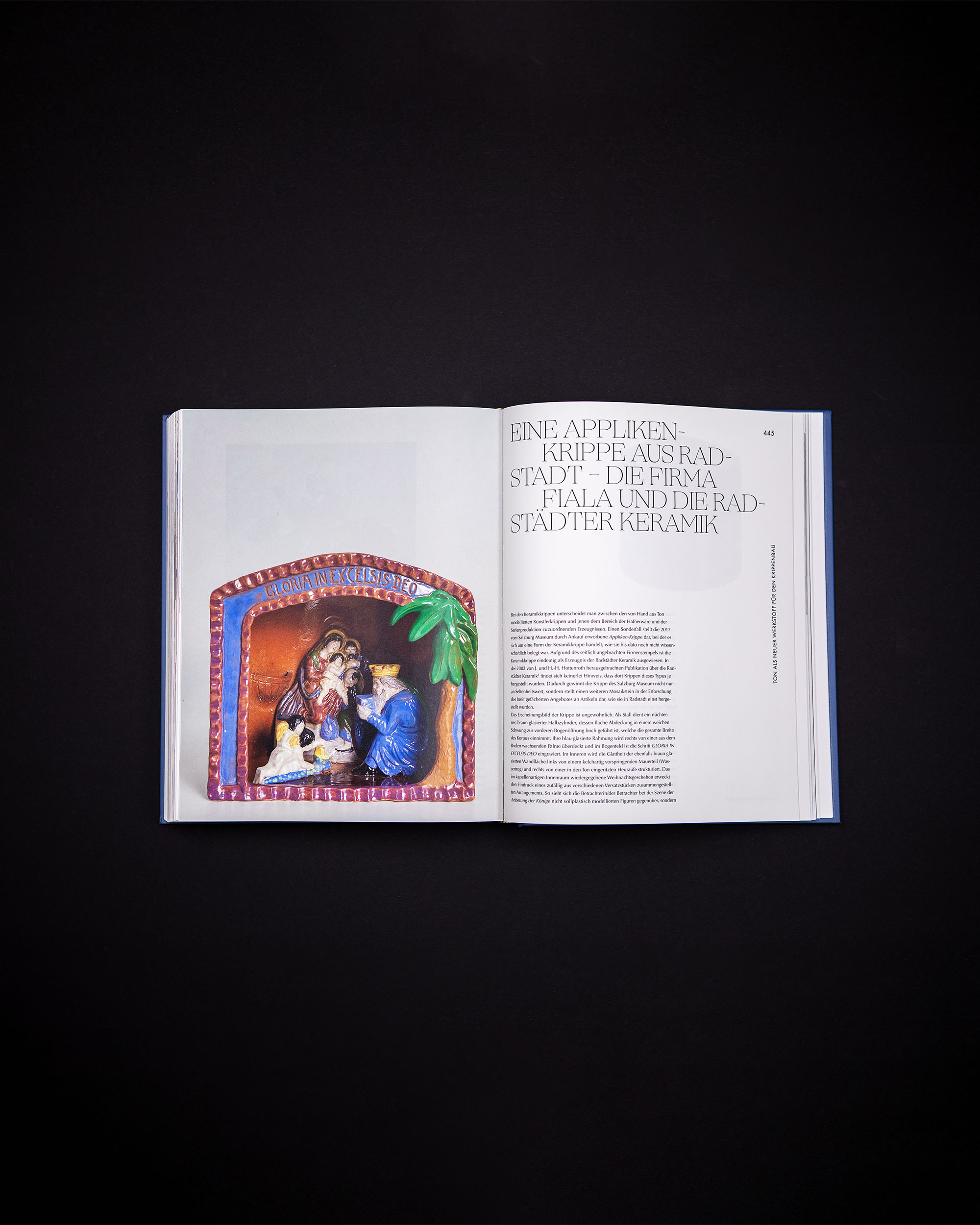 Book spread with a box nativity scene, heading and explanatory text