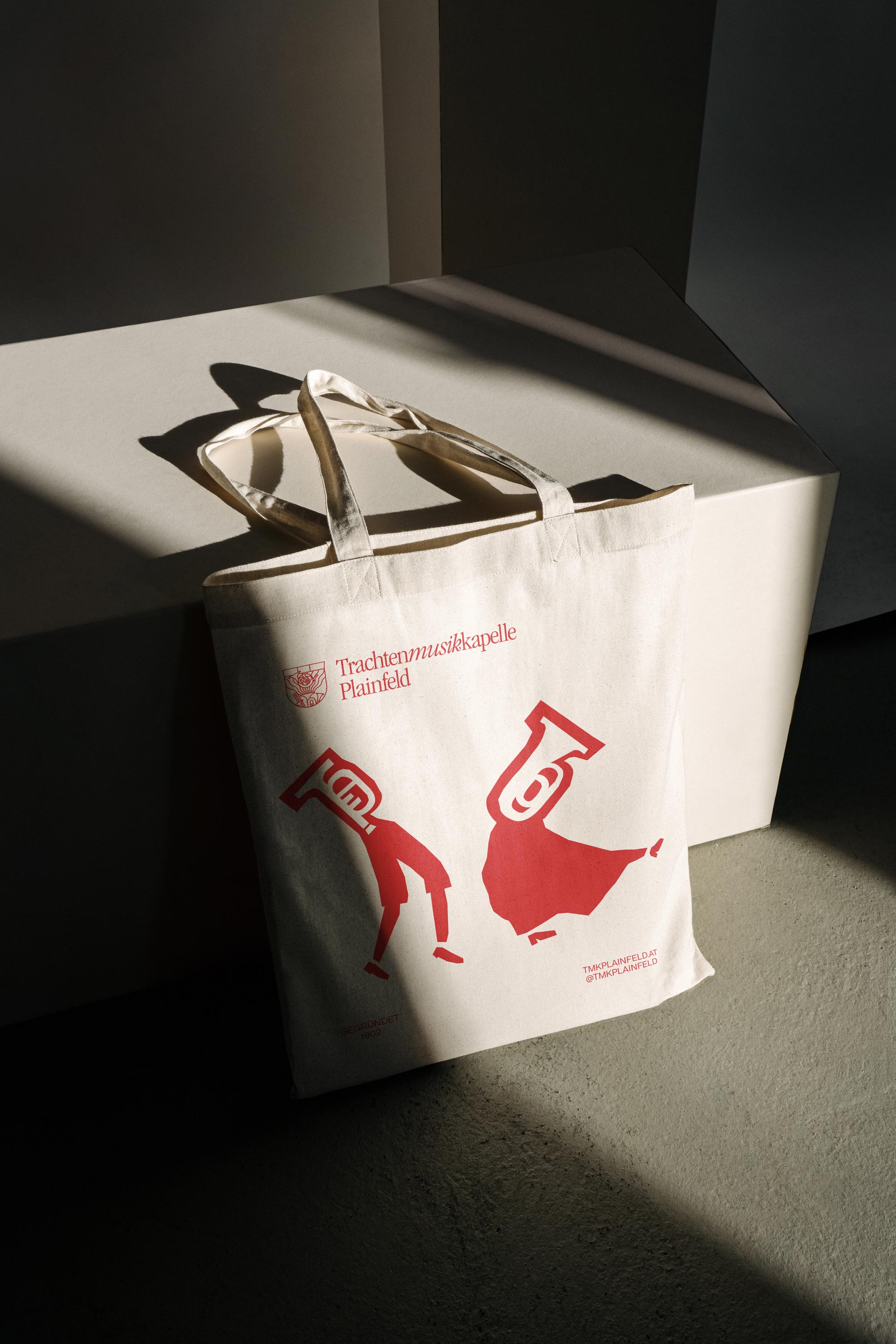 Tote bag with a red musician illustration for Trachtenmusikkapelle Plainfeld